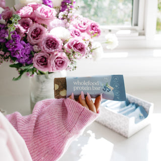 Nutrient-dense Blueberry White Choc Crumble Protein Bar from Sneaky Wholefoods, ideal for a mid-morning boost or as a wholesome treat to support sustained wellbeing.
