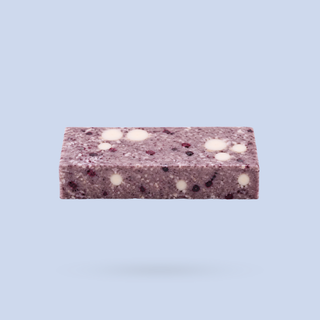 Blueberry White Chocolate Crumble Wholefood Protein Bar revealing bar inside 