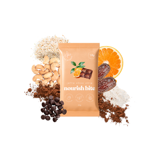 A single pouch of 'nourish bite' Jaffa chocolate chip  is centered on a white background, surrounded by its ingredients: cashews, cocoa powder, chocolate chips, dates, and an orange slice.