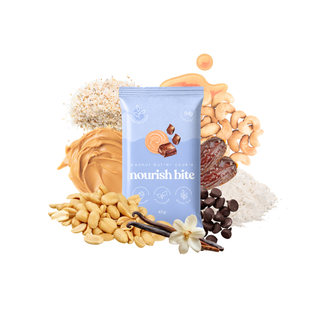 A single packet of 'nourish bite' peanut butter cookie centered on a white background, surrounded by its ingredients: peanut butter, cashews, chocolate chips, dates, and peanuts