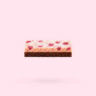 A singular Raspberry Lamington Nourish Bite shown floating against a solid pale pink background.