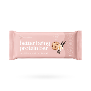 A pink wrapper for a protein bar labeled 'better being protein bar' and 'vanilla cookie dough', shown on a clean white background with a soft shadow underneath.