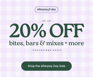 Promotional graphic for Afterpay Day sale with large text reading 'UP TO 20% OFF bites, bars & mixes + more' and a button that says 'Shop the Afterpay Day Sale' on a pale lavender gingham background.