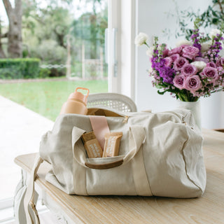 Sneaky Wholefoods Peanut Butter Caramel Snick Snack Protein Bars packed in a gym bag, a convenient, plant-based, gluten-free snack for active lifestyles.