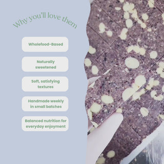 Video showcasing Sneaky Wholefoods blueberry white choc crumble and apple white choc pie protein bars in a production setting, switching between different flavours while highlighting key features including wholefood-based ingredients, naturally sweetened, soft satisfying textures, handmade weekly in small batches, and balanced nutrition for everyday enjoyment.