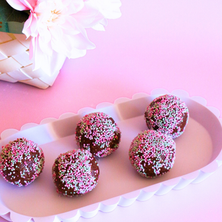 Chocolate Speckled Cake Pop Protein Ball layed out on a platter for eating 