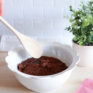 Raspberry Fudge Brownie Protein Ball Mix being poured into a bowl – a nutritious and delicious mix for making high-protein, gluten-free snacks.