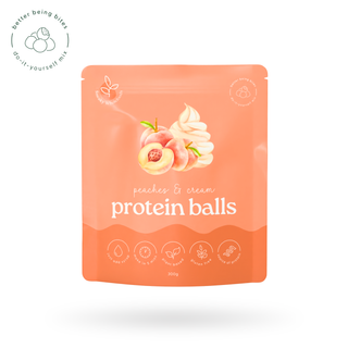 Protein ball package with peach and cream design on a white background